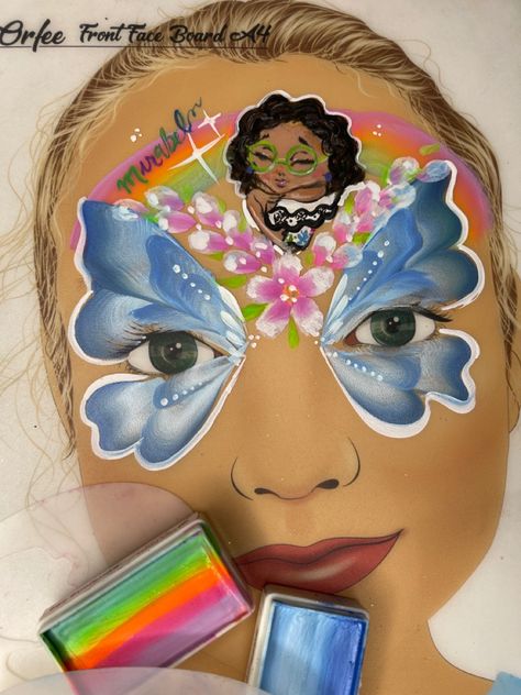 Milena’s stencils Face Paints Australia Lizzieland_art Encanto Face Paint, Encanto Face Painting Ideas, Encanto Face Painting, Butterfly Facepainting Ideas, Flowers Facepainting, Reference Face, Rainbow Butterfly Face Paint Easy, Facepainting Butterfly Simple, Family Madrigal