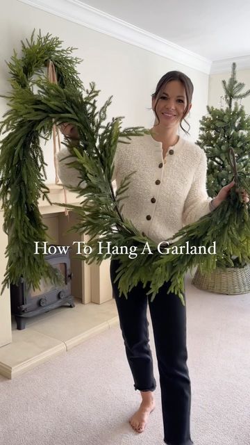 Christmas Faux Fireplace Decor, Garland On Fireplace Christmas, Making A Wreath Out Of Garland, Traditional Christmas Fireplace Garland, Mantle Garland With Bells, Mantle Christmas Garland Ideas, Bell Garland Mantle, Norfolk Pine Garland Fireplace, Cedar Garland Christmas Mantle