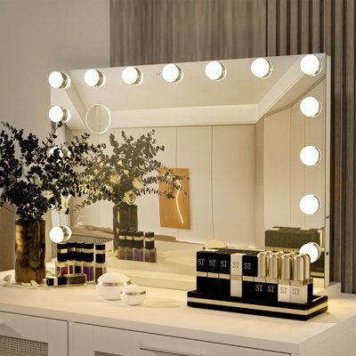 Indecisive about your purchase? Take the leap and go for it! This mirror is a game-changer for revamping your vanity space. With its ideal size for a small desk or vanity, you have the flexibility to position it closer or further away. It provides a generous view without overpowering your counter space. The Hollywood makeup vanity mirror features gentle, adjustable lights that create a soft, natural glow, making your makeup routine a breeze. Enjoy a flawless reflection with every application, an Hollywood Style Mirror, Bulb Mirror, Comfortable Bedroom Decor, Frameless Vanity Mirrors, Vanity Space, Hollywood Vanity Mirror, Mirrors For Makeup, Hollywood Makeup, Lighted Vanity Mirror