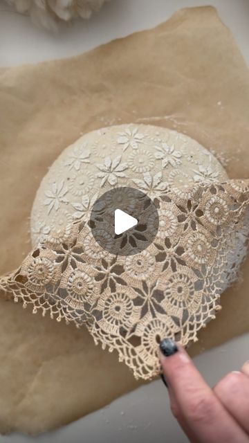 Melody Brandon on Instagram: "I remembered I had this piece of lace. I got it in Greece this past summer, so Donovan and I tried it out and this is the result! 💛 Adding lace is an easy way to get a more intricate look on your sourdough. This time I added in scoring patterns as well, and then did the large cut after it baked in the oven for five minutes. If you are looking for an easy, but delicious sourdough recipe that scores really well too, you can comment SOURDOUGH below, and I’ll send you the details of my e-book!" Sourdough Lace Pattern, Spiderweb Sourdough Scoring, Easter Egg Sourdough Scoring, Easter Sourdough Bread Scoring, Sourdough Decorative Scoring, Lace Sourdough, Easter Sourdough Scoring, Bread Scoring Patterns Easy, Sourdough Cut Designs