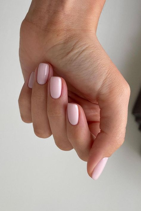 These almond-shaped nails showcase a soft pink polish with a glossy finish, offering a touch of elegance and simplicity that's perfect for any occasion. The smooth, uniform color exudes understated chic.  // Photo Credit: Instagram @samantharudge.beauty Nail Polish Colors For Short Nails, Short Nails Soft Pink, Summer Nude Nail Colors, Short Soft Nails, Soft Pink Manicure, Nail Ideas Elegant Classy, Soft Elegant Nails, Soft Color Nail Ideas, Short Soft Square Nails