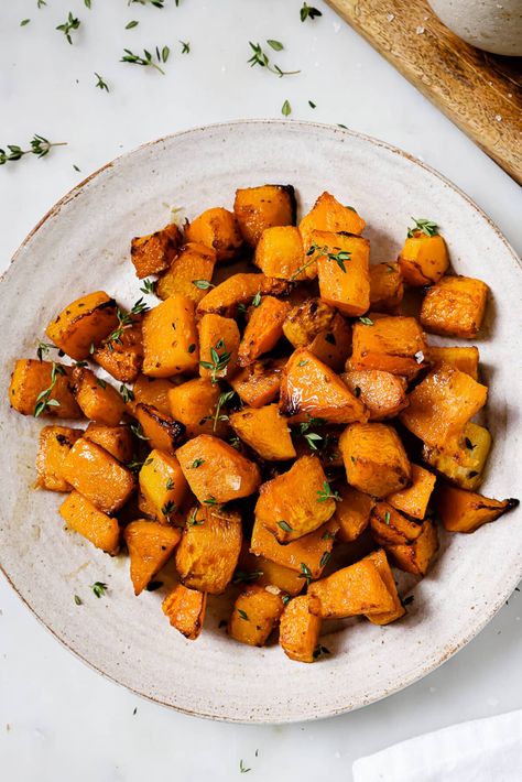 A serving platter of air fryer butternut squash garnished with thyme. Airfry Butternut Squash Recipes, Butter Ut Squash Recipes Air Fryer, Air Fried Butternut Squash, Air Fryer Butternut Squash Recipes, Airfryer Squash, Butter Ut Squash Recipes, Beet Orange Salad, Air Fryer Squash, Air Fryer Cod Recipe