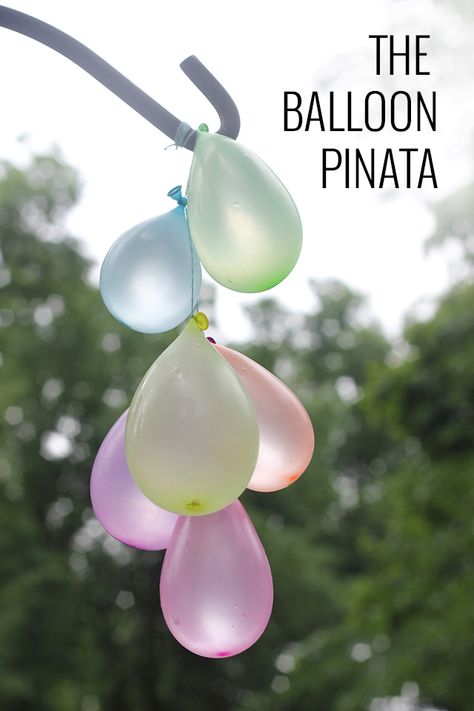 A twist on the traditional pinata game with the prize being a great splash! Fill a handful of balloons and tie them together with string strong enough to hold the weight of the full balloons. Find a great location to hang the pinata for the various players to reach. Perhaps a tree limb, a playset, or a gardening tool might work well.  Be ready for a few sets of swings to make sure all the balloons have burst! Water Balloon Pinata, Water Pinata, Pinata Game, Balloon Pinata, Water Balloon Games, Balloon Games, Balloon Glow, Water Games For Kids, Hawaiian Birthday Party