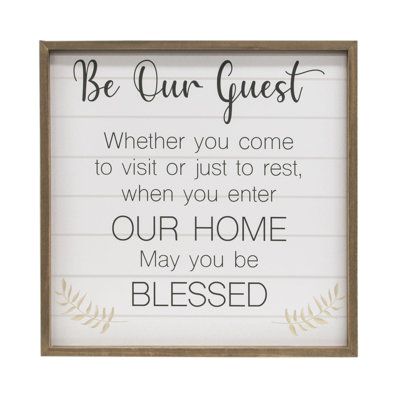 Be Our Guest Framed Sign is made of wood and features a pre-installed sawtooth hanger for easy wall display. The sign reads, "be our guest - whether you come to visit or just to rest, when you enter our home may you be blessed" in black text over a distressed white background with a slatted look. It looks great hung above an entryway console or the wall of a guest bedroom and Be Our Guest, Entryway Console, Thankful And Blessed, You Are Blessed, Accent Wall Decor, Be Blessed, Coffee Station, Easy Wall, Rustic Signs