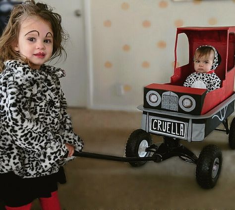 DIY Cruella DeVille Costume and Car #cruelladeville #101dalmations #familycostume #diy #girlcostume #toddlercostume #halloween #diy Cruella Deville And Puppy Costume, Diy 101 Dalmatian Costume, Cruella Deville Costume Kids, 101 Dalmations Costume Family, Cruella Deville Car, Diy Cruella Deville Costume, Family Costumes For 4, 101 Dalmations Costume, Wagon Costume