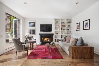 29 W 19th St, New York, NY 10011 - 12 Photos | Trulia Transitional Fireplaces, Traditional Family Rooms, Contemporary Bench, Small Fireplace, Sunroom Designs, Open Living Room, Room Additions, Built In Bookcase, Modern Fireplace