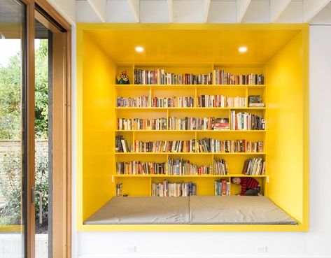 A Bright Yellow Reading Nook Steals the Show in This Energy-Efficient Portland Abode - Dwell Living Photo, Room Shelves, Living Room Shelves, Modern Barn, Built In Desk, Eco Friendly House, Home Library, Architect Design, Banquette