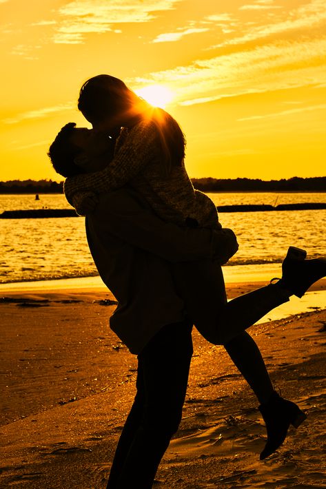 Engaged couple kiss at golden sunset on the beach Beach Couple Sunset Photos, Healthy Masculine, Beach Kiss Romantic, Romantic Sunset Couple, Couples Sunrise Beach Photos, Sunset Kiss, Beach Romance, Couple Beach Pictures, Couple Beach Photos