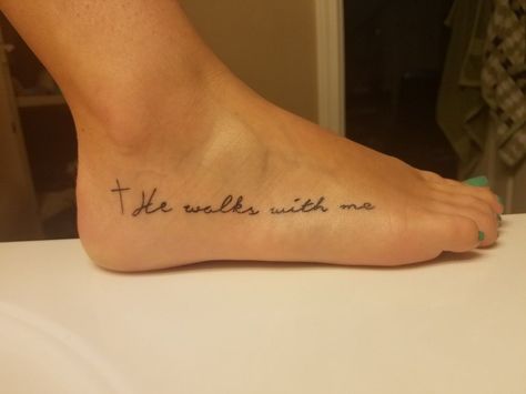 He Is With Me Tattoo, He Walks With Me Foot Tattoo, Cute Foot Tattoos For Women, Side Foot Tattoos For Women, He Walks With Me Tattoo, Walk By Faith Foot Tattoo, Faith Foot Tattoos, He Walks With Me, Foot Tattoo Quotes