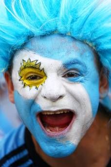 BELO HORIZONTE, BRAZIL - JUNE 21:  An Argentina fan enjoys the atmosphere prior to the 2014 FIFA World Cup Brazil Group F match between Argentina and Iran at Estadio Mineirao on June 21, 2014 in Belo Horizonte, Brazil.  (Photo by Paul Gilham/Getty Images)