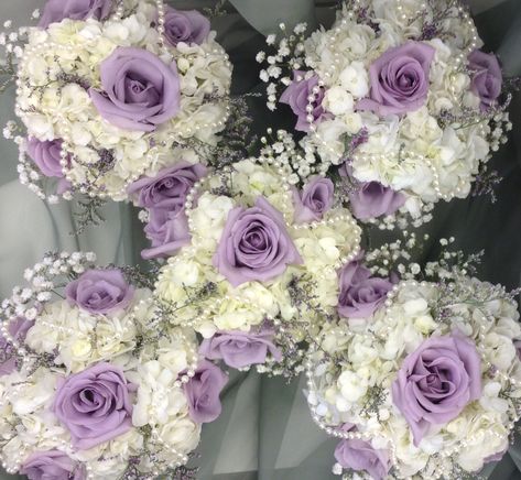 Lavender and white bridesmaid's bouquets with hydrangea, roses, babies breath and pearl accents by Nancy at Belton hyvee. Lavender And Pearl Wedding, Purple Bridesmaids Bouquets, Quince Bouquet Purple, Lavender Quince Bouquet, Lavender And White Rose Bouquet, Light Purple And White Bouquet, Bride Bouquets White And Purple, Bridesmaid Bouquet Purple And White, White Bouquet With Purple Accents