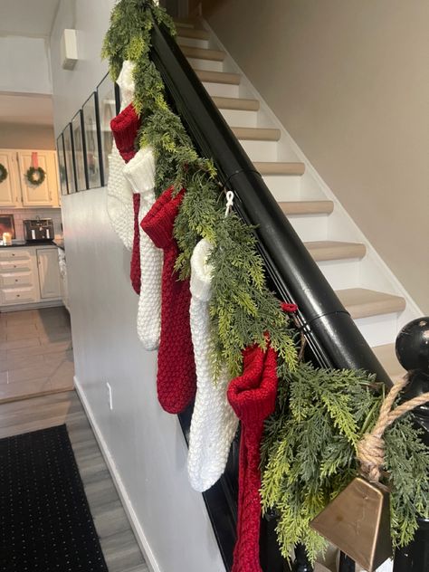 Hang Stockings On Stairs, Garland And Stockings On Staircase, Stockings On Staircase Banisters, Christmas Staircase Stocking Decor, Stocking Staircase, Stocking On Staircase, Hanging Stockings On Staircase, Stockings With No Mantle, Stocking Display No Mantle