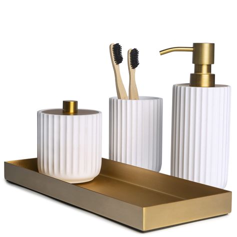 PRICES MAY VARY. Nullify Handcrafted from Finely Sculpted Resin & Stainless Steel - Our 4 piece bathroom decor sets accessories are designed to add a uniquely modern traditional appeal and infuse effortless style into your space design. Exceptional Quality & Style - Our White & Gold Collection feature a ribbed texture with antique brass accents. Made with high-quality resin and rust-proof stainless steel, our collection is durable and long-lasting. The pump of the soap dispenser is sturdy and ea White Bathroom Accessories Set, Soap Dispenser Set, White Bathroom Accessories, Gold Bathroom Accessories, Boho Bathroom Decor, Bathroom Decor Sets, Bathroom Accessories Sets, Bathroom Accessory Sets, Gold Bathroom