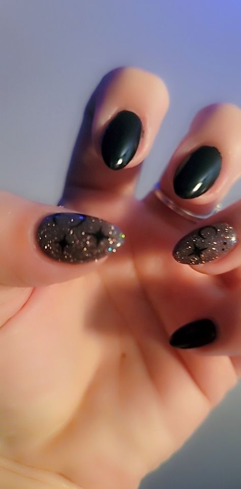 Celestial Black witchy nails with moon and star detail Black And Gold Moon Nails, Black Nails For Prom Almond, Black Nails With Holographic Glitter, Black Almond Nails Designs Glitter, Black Glitter Almond Nails, Black Nails With Stars, Star Glitter Nails, Red Nail Designs For Prom, Prom Nails Green