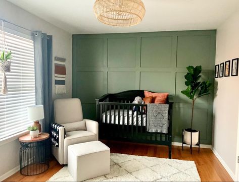 Green wall nursery Black Crib Green Walls, Sage Green Nursery Black Crib, Sage And Black Nursery, Olive Green Accent Wall Nursery, Sage Green Wall Nursery, Sage Green Wainscoting Nursery, Green Nursery Black Crib, Black White And Green Nursery, Sage Green And Black Nursery