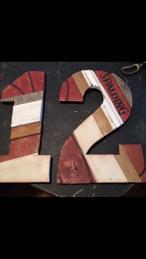 Sport numbers created from recycled basketballs and salvage wood. Hatchett Designs. Sports Wood Projects, Football Banquet Centerpieces, Diy Numbers, Basketball Ideas, Banquet Centerpieces, Football Banquet, Sports Numbers, House Wood, Sports Decorations