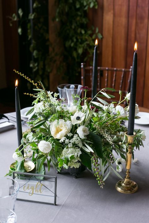 Dramatic Black Taper Candles in Vintage Brass Holders Black Candle Centerpieces, Green Wedding Arrangements, White Candles Wedding, Taper Candle Centerpiece, Candlestick Centerpiece Wedding, White Wedding Flowers Centerpieces, Taper Candles Wedding, Pillar Candles Wedding, Black Candlesticks