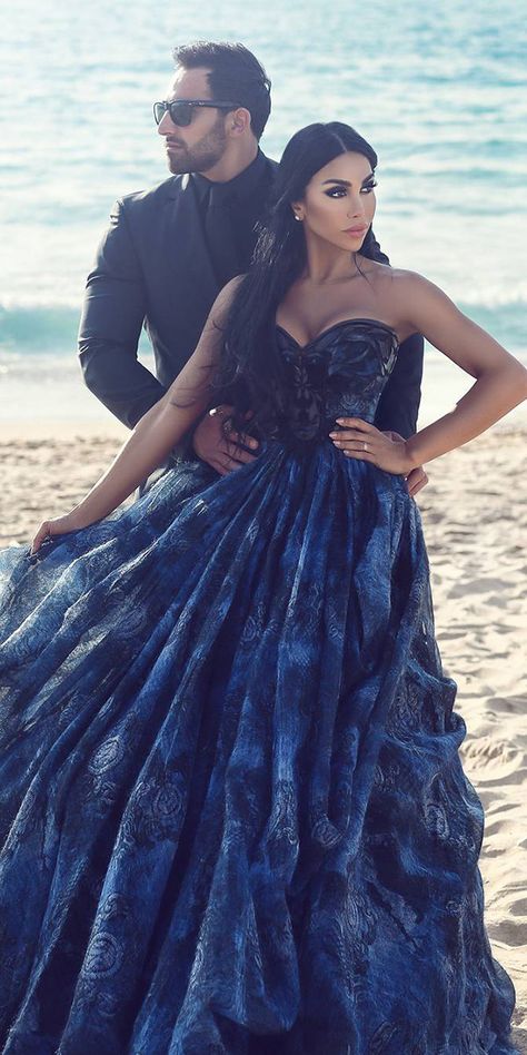 Dark Romance: 21 Gothic Wedding Dresses ★ See more: https://weddingdressesguide.com/gothic-wedding-dresses/ #bridalgown #weddingdress Blue Black Wedding Dress, Dark Colored Wedding Dresses, Royal Blue And Black Wedding Dress, Dark Blue Wedding Dress Brides, Blue And Black Wedding Dress, Black And Blue Wedding Dress, Midnight Blue Wedding Dress, Blue Gothic Wedding, Royal Blue And Black Wedding