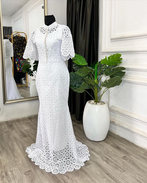 Dainty and delicate! This understated yet stunning bespoke dress for the Teramarg woman embodies soft femininity. Featuring a white cord lace fishtail design with a bishop collar, adorned with pearl buttons down the center bodice and bell sleeves. Perfect for making an elegant statement. Reach us on⬇️ ✅Click on the link on our bio to chat with us on WhatsApp ✅Send us a dm ✅Call us on 08103672667 ——————————————————— . . . . . . . . . . . . . . . . . . . . . . . . . #ankaradress #pre... White African Lace Styles, Cord Lace Styles, Bishop Collar, Bespoke Dress, African Lace Styles, Cord Lace, Lace Styles, Ankara Dress, African Lace