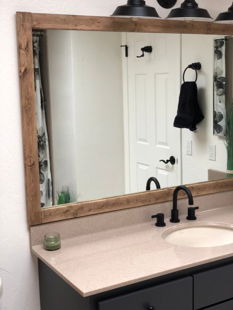 $5 Farmhouse Mirror – Lifestyle and Lumber Cheap Bathroom Mirror Makeover, Adding Frame To Bathroom Mirror, Farmhouse Mirror Frame, Diy Wood Mirror Frame, Diy Mirror Frame Bathroom, Wood Framed Bathroom Mirrors, Rustic Mirror Frame, Wooden Bathroom Mirror, Master Bath Mirror