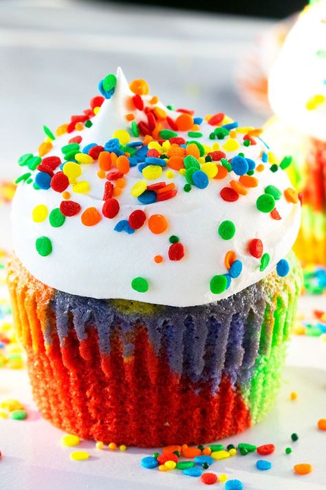 Easy rainbow cupcakes recipe, homemade with simple ingredients. Starts off with cake mix. Tie dye batter is baked and decorated with whipped cream and colorful sprinkles. Super light and fluffy cupcakes, perfect for birthday parties or St.Patrick's Day. Rainbow parties and dessert tables have been very popular for a few years now and today's dessert would be perfect for that theme. Be sure to have a look at this Colorful Shapes Birthday Party for even more ideas and if you are still stuck, ... Rainbow Cupcakes Recipe, Easy Cupcakes Decoration, Tie Dye Cupcakes, Cake Mix Cupcakes, Fluffy Cupcakes, Rainbow Desserts, Rainbow Cookies, Rainbow Cupcakes, Rainbow Food