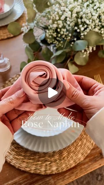 Life Stylishly - Home Decor on Instagram: "💕How to fold a napkin into a rose 🌹 Comment ‘ROSE’ to get all the details sent straight to your inbox!

These napkin roses add the perfect romantic touch to your Valentine’s dinner or Galentine’s party, but they’re also stunning for other celebrations! 🌸 

Use napkins in the color scheme of the bride’s flowers for a beautiful bridal shower or in soft tones for a darling baby girl shower.

Save this for later and shop everything in my LTK💕 https://liketk.it/53uom" Rose Napkin Fold, Napkin Roses, Fold A Napkin, Napkin Rose, How To Make Rose, How To Fold, Girl Shower, A Rose