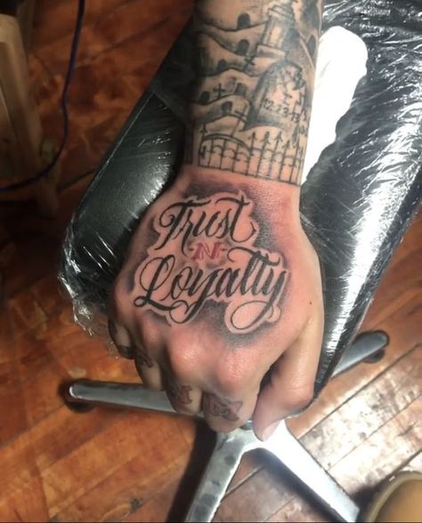 Trust N Loyalty Tattoo Hand, Hand Qoute Tattoo, Loyalty Rose Tattoo, Trust And Loyalty Tattoos, Trust N Loyalty Tattoo, Chest Tattoo Men Ideas One Side, Loyalty Hand Tattoos For Guys, Hand Tattoos Cute, Get Rich Or Die Trying Tattoo