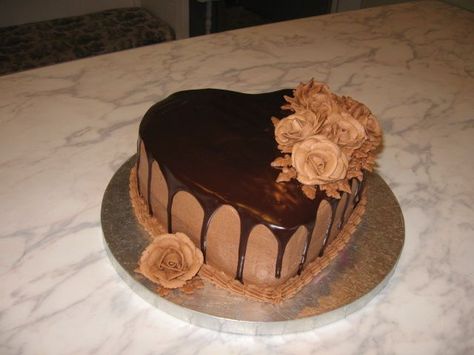 chocolate lovers dream - heart-shaped chocolate fudge cake filled with chocolate buttercream. first time using ganache. chocolate buttercream roses. Chocolate Heart Cake Decoration, Heart Shape Cake Designs, Fudge Cake Filling, Chocolate Heart Cakes, Heart Cake Design, Valentines Day Cake, Chocolate Truffle Cake, Chocolate Cake Designs, Buttercream Roses