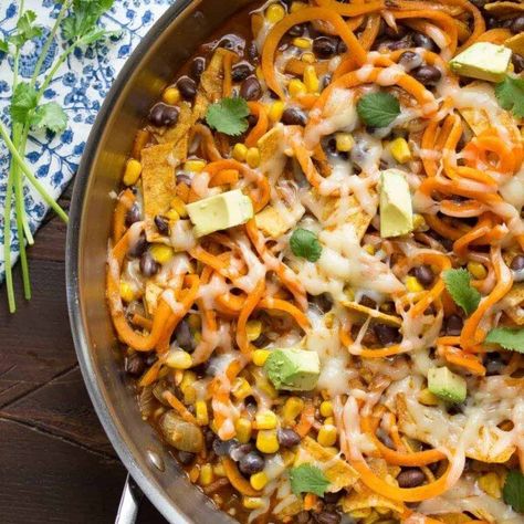 overhead shot of enchilada sweet potato noodles skillet in large pan on table Healthy Skillet Meals, Healthy Skillet, Sweet Potato Burrito, Sweet Peas And Saffron, Enchilada Skillet, Spiralized Sweet Potato, Sweet Potato Skillet, Chicken Skillet Recipes, Sweet Potato Noodles