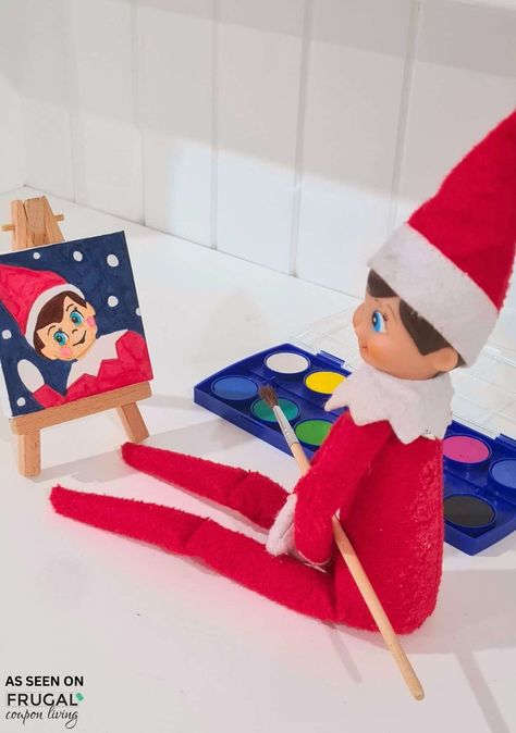 Give your holiday elf a creative twist with this fun idea for The Elf on the Shelf! Watch your festive scout draw a self-portrait on a miniature canvas with a paintbrush and watercolors. Learn how to set up this easy, artistic scene to surprise your kids and add some extra holiday magic to your elf’s daily antics! New Ideas for The Elf on the Shelf and free Christmas printbles. Elf On The Shelf Painting Canvas, Elf On The Shelf Painting Ideas, Elf Canvas Painting, Elf On The Shelf Painting, Elf On The Shelf Drawing, Elf Painting, Shelf Painting, Elf Drawing, Elf Stuff