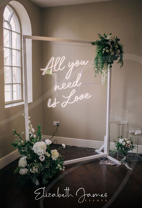 Such a lovely shot of our Neon 'All you need is Love' Sign on White Frame, dressed with our Faux Ivory and Foliage Arrangements at the beautiful @stubtonhall 🌿 This setup makes the perfect backdrop to your card & gift table in this entrance area to the main Orangery, and our Clear Acrylic Car box is the perfect accompaniment 🤍 Photo with thanks to @darren_cresswell_photography 📸 All You Need Is Love Neon Sign, Neon Sign On Arch, Wedding Brainstorming, Luxury Event Decor, Rose Gold Wedding Decor, Foliage Arrangements, Car Box, Sign Photography, Corporate Events Decoration