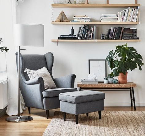 grey armchair with a matching footstool creating the perfect reading nook Ikea Uk, Balcony Table And Chairs, Ikea Kitchen Design, Shabby Chic Table And Chairs, Storage Ottomans, Zen Room, Cosy Corner, Room Partition, Apartment Style