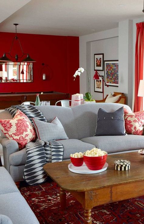 THE LOOK A large-scale room needn’t be overwhelming. If you bookend the space by painting the walls at opposite ends of the room in an intense hue, it helps shrink the distance. Keep the side walls a neutral tone, such as grey. The overall effect will be light and impactful. Grey And Red Living Room, Red Accent Wall, Grey Walls Living Room, Red Living, Living Room Decor Gray, Drag Makeup, Living Room Red, Living Room Color Schemes, Design Salon