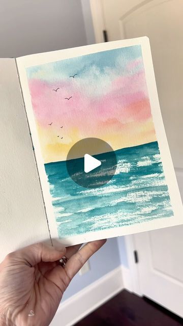 Andrea Nelson on Instagram: "This simple summer sketchbook page is the perfect thing to try if you’re new to watercolor or if you just want something that’s really easy but will make you super proud! Supplies are my brand and are on my page   Supplies: Watercolor sketchbook 24 color essential palette Size 8 round brush Artist tape .2 pen Dr martins bleed proof white  #easyart #easywatercolor #summerart #watercolorbeach" Summer Sketchbook, Andrea Nelson Art, Watercolor Night Sky, Watercolour Challenge, Busy Mind, Watercolor Beginner, Relaxing Art, Watercolor Sunset, Handmade Paint