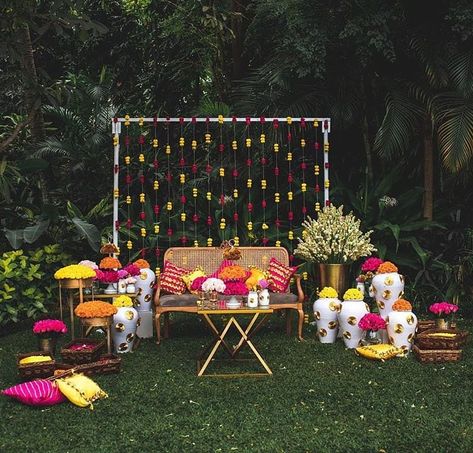 Minimalistic and colorful Mehendi decor with Gota Patti inspiration.. Decor @withlovenilma Photography @romaganeshphotography Venue @tajwestend Follow www.decorsutrablog.com for Ideas about Indian Wedding Decor Email your original pictures to @decorsutrablog@gmail.com to get featured. #wedmegood #weddingsutra #shaadisaga #shaadimagic #weddingz #WeddingInspiration #decoration #weddinginspo #instawedding #weddingflowers #haldiceremony #weddingreception #traditionalwedding #engagementdecor #wed Mehndi Decor At Home, Mehendi Decor Ideas, Mehndi Decor, Wedding Design Decoration, Corner Decor, Quirky Decor, Engagement Decorations, Wedding Decor Inspiration, Best Wedding Planner