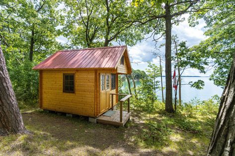 My partner, Patrick Biller, built his own cabin from a Bunkie Life kit (it’s the Loft model) on a patch of birch-canopied land near North Bay, Ontario. | Photographer: Courtesy of Bunkie Life Bunkie Life, Bunkie Ideas, Cubic Mini Wood Stove, Small Space Inspiration, White Exterior Paint, Urban Barn, North Bay, Backyard Shed, Scandi Design