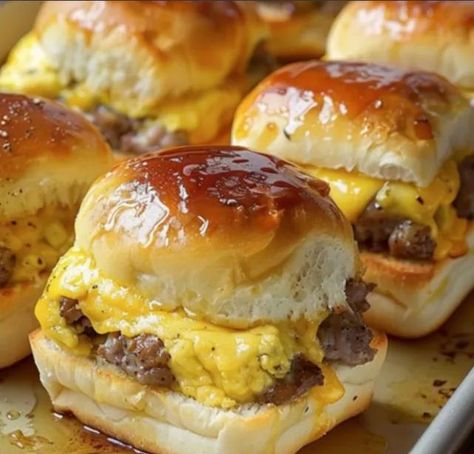 Sausage Egg and Cheese Breakfast Sliders     Ingredients     24 ounces ground pork sausage, 2 breakfast sausage rolls, like Jimmy Dean 12 Hawaiian buns, or other slider buns 8 large eggs, scrambled 6 slices pepper jack cheese 8 slices American cheese 1/2 cup butter, melted 1/4 cup maple syrup     Instructions     Preheat oven to 350°F. Warm large skillet over medium heat. Form sausage into 12 patties, slightly larger than one dinner roll. Add sausage to skillet and cook until completely ... Sausage Egg And Cheese Breakfast Sliders, Tailgate Breakfast Sliders, Jimmy Dean Maple Sausage Recipes, Sausage Egg And Cheese Rolls, Hawaiian Roll Sliders Breakfast, Pork Sausage Recipes Breakfast, Recipes With Maple Sausage, Hawaiian Roll Breakfast Sliders, Jimmy Dean Sausage Recipes