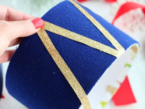 DIY Drum Christmas Gift Box | Fun365 Diy Christmas Drum Ornament, Nutcracker Gift Box Diy, Drum Ornaments Diy, Christmas Drum Decoration Diy, Diy Nutcracker Drum, Diy Drum Ornament, Drum Centerpiece Ideas, Christmas Drum Diy, Christmas Drum Decoration