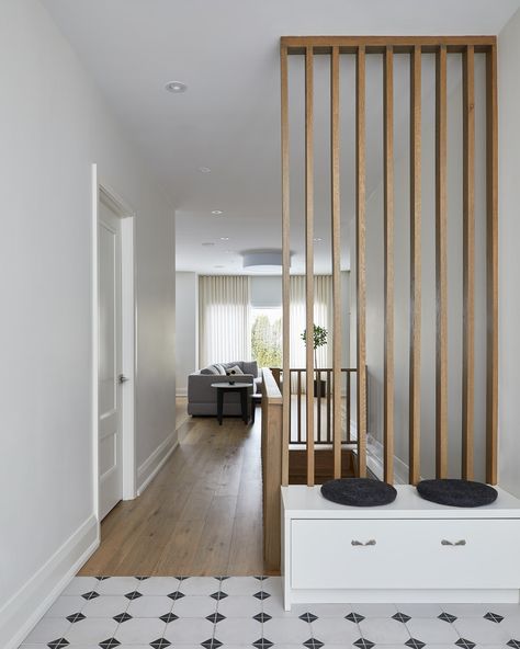 Modern Entryway Tiles, Wood Panel, Floor Transition, Bench with Shoe Storage Entryway Room Divider, Entryway Tiles, Entryway Divider, Millwork Design, Room Divider Wood, Floor Transition, Entryway Tile, Modern Farmhouse Living Room Decor, Entryway Flooring