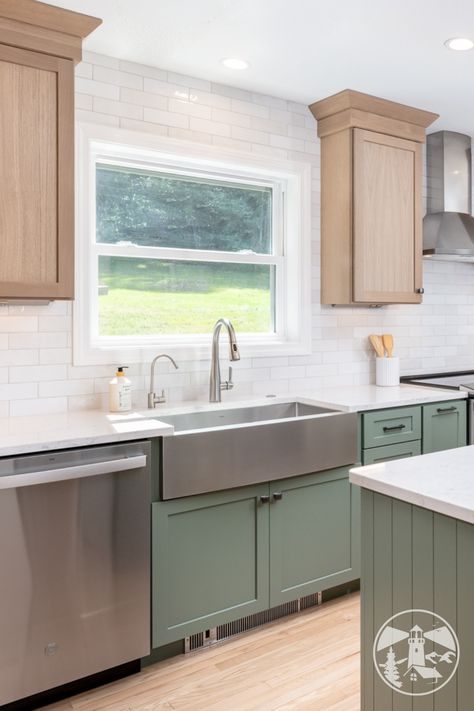 This beautiful kitchen features a sleek stainless steel farmhouse sink by Kraus, adding both style and functionality to the space. Paired with a discreet toe kick heater under the sink base, you’ll enjoy warm feet and a modern, clutter-free look. Steel Farmhouse Sink, Stainless Steel Farmhouse Sink, Green Kitchen Designs, Baseboard Heating, Refinishing Floors, Green Cabinets, Kitchen Features, Cabinet Space, Beautiful Kitchen