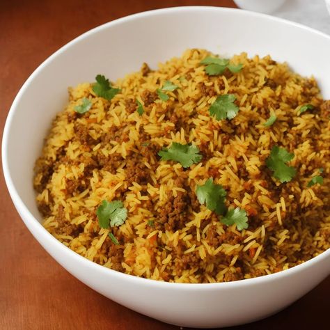 Keema pulao is a popular Indian recipe made with tender rice grains mixed with a flavourful keema masala. Pair with some refreshing raita and serve as a delicious dinner for the whole family. Rice is a common ingredient in many cuisines, and each culture has its own recipes for this versatile ingredient. In Indian cuisine […] The post Keema Pulao appeared first on Scrumptiously. Keema Pulao, Indian Buffet, Chicken Keema, Romantic Breakfast, Minced Meat Recipe, Eid Food, Pulao Recipe, Indian Recipe, Pakistani Food