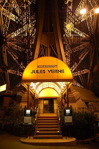 The prestigious “Le Jules Verne Restaurant” is located on the second floorÂ in France’s most famous landmark – The Eiffel Tower. With more than 6.7 million visitors last year, it’s the symbol of Paris. The restaurant has a private elevator, which zips you up 125 meters above ground. No trip to the French capital is complete without it.  We found early reservations are a must. Restaurant Paris, Paris Jackson, Jules Verne, Paris Restaurants, Paris Love, Living In Paris, The Eiffel Tower, Paris Saint-germain, Paris Hilton