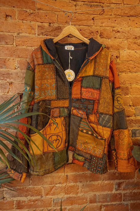 "Stunning patchwork jacket made with 100% recycled cotton outer, and 100% recycled fleece inner. Thick and cozy! Hooded with a zipper and outer pockets. Each is one-of-a-kind and will not be the exact jacket in the photos, but will be very close in color!   Fits XS-XXL Bust- 48\" Waist- 47\" Length - 29\""