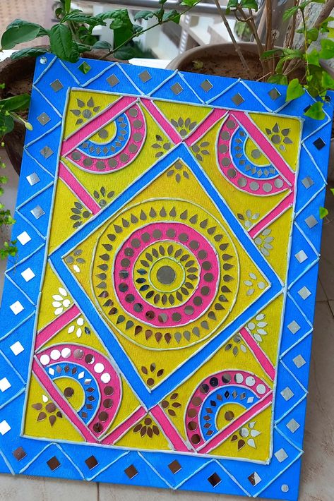 Lippan art with mirrors and air dry clay on a rectangle canvas. The color used is yellow, blue and pink. The canvas is filled with geometric figures like semi-circle, circle, triangle, and squares. Lippan Art On Rectangle Board, Lippan Art Rectangle Shape, Mouldit Art, Lippan Mirror, Lippon Art, Dhokra Art, Lipan Art, Mandala Book, Butterfly Art Drawing