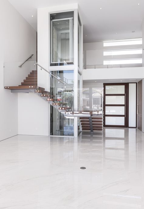 Elevator Stairs Design, Glass Elevator In House, Stairs Around Elevator, Home With Elevator, Elevator Home Design, Stairs With Elevator Design, House Elevator Ideas, Elevator With Stairs, Small Elevators In Homes