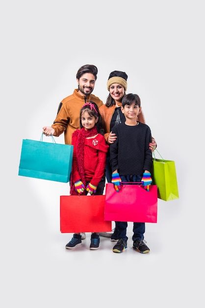 Family Celebrating Diwali, Carry Bag Design, Indian Family, Winter Shopping, Winter Girl, Warm Clothes, Radha Krishna Images, Shopping Photography, Bag Stand