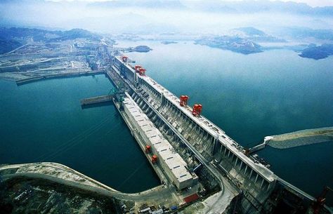 The Three Gorges Dam is a hydroelectric gravity dam that spans the Yangtze River by the town of Sandouping, in Yiling District, Yichang, Hubei province, China. The Three Gorges Dam is the world's largest power station in terms of installed capacity (22,500 MW). In 2014 the dam generated 98.8 terawatt-hours (TWh) and had the world record, but was surpassed by the Itaipú Dam, which set the new world record in 2016, producing 103.1 TWh. Three Gorges Dam, Dam Construction, Hydroelectric Power Plant, Earths Rotation, Hydroelectric Dam, Water Dam, Hydroelectric Power, Hoover Dam, Hydro Electric