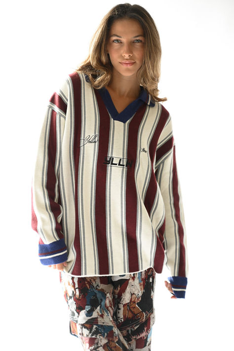 The Racer Knit is a thick sweater that marries warm burgundy and cool colors in a vertical striped pattern with branded embroidery on the chest. The sweater fits oversized with a relaxed knit collar and V-neck. Stripe Knit Sweater, Brand Embroidery, Thick Sweater, Fall 24, Cool Colors, Fall Inspo, Sweater Fits, Thick Sweaters, Oversize Knit