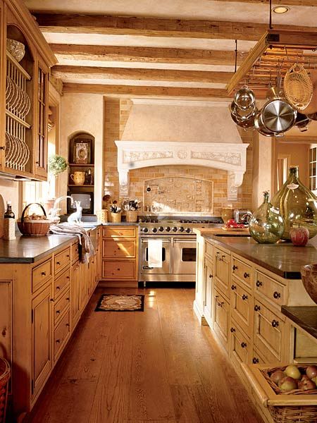 I will be needing a good kitchen. :) Earth tones prevail in this open kitchen that looks as if it's been in place for centuries. Open shelving, naturally finished cabinets, and a pot rack over the center island provide abundant storage. Old World Kitchens, Southern Kitchens, Fabulous Kitchens, Gorgeous Kitchens, Old Kitchen, Large Kitchen, Beautiful Kitchens, Kitchen Stuff, Country Kitchen