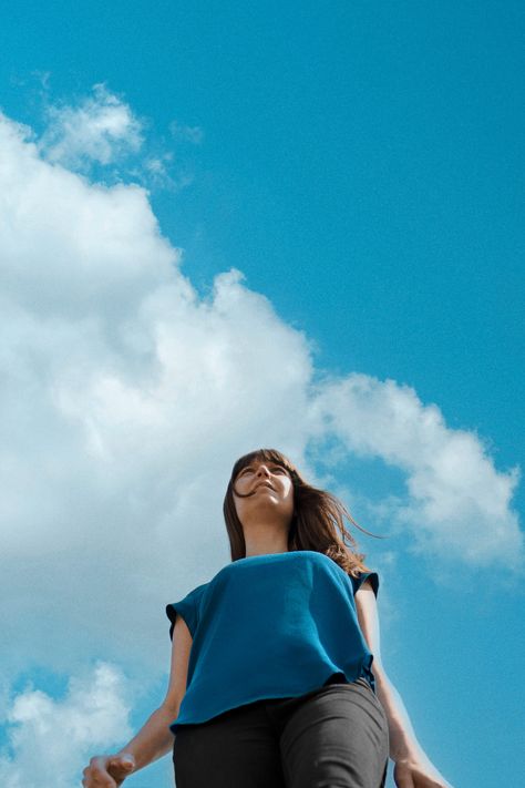 Sky photoshoot and low angle portrait, shot against a blue cloudy sky backdrop. Blue sky portrait of musician and female guitarist Camilla Overgaard. Here's some retro blue colors and cool sky background aesthetics. Portrait by Ther Artist Portraits Blue Sky Portrait, Conference Backdrop, Portrait Composition, Sky Portrait, Blue Cloudy Sky, Sky Backdrop, Background Aesthetics, Artist Portraits, Composition Ideas